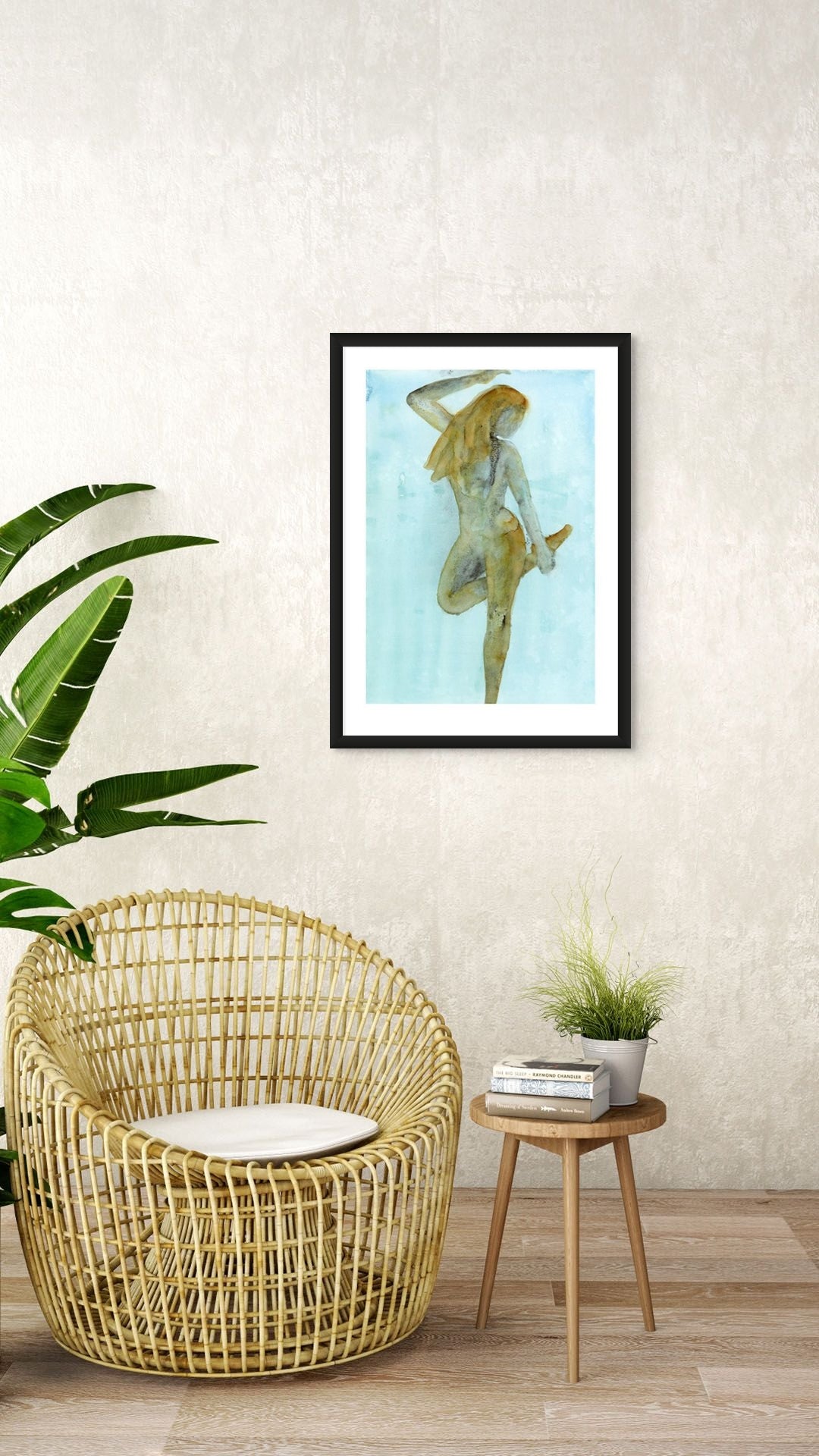 Limited Edition Fine Art Giclée Print of a watercolour female figure embodying the season of Winter, A1 sized, displayed on a wall. The colours are an earthy gold and brown with graphite on a beautiful blue background. 