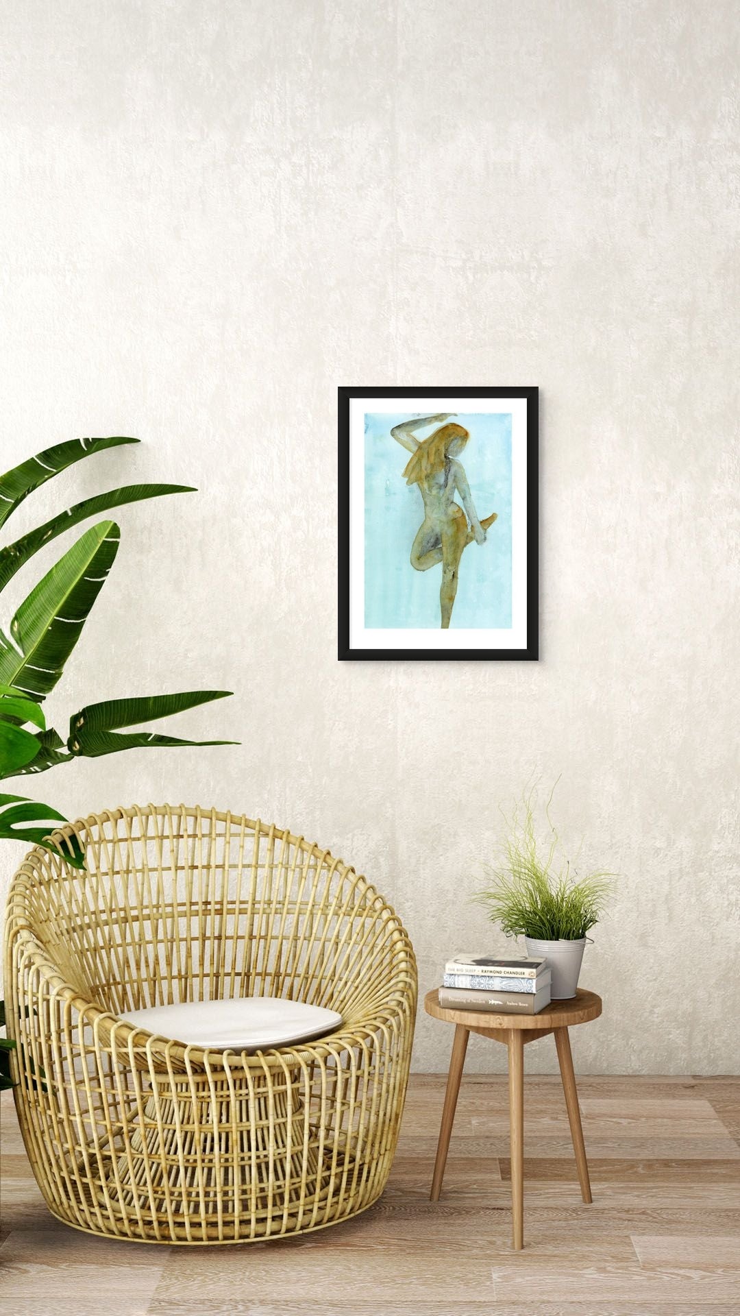 Limited Edition Fine Art Giclée Print of a watercolour female figure embodying the season of Winter, A2 sized, displayed on a wall. The colours are an earthy gold and brown with graphite on a beautiful blue background. 