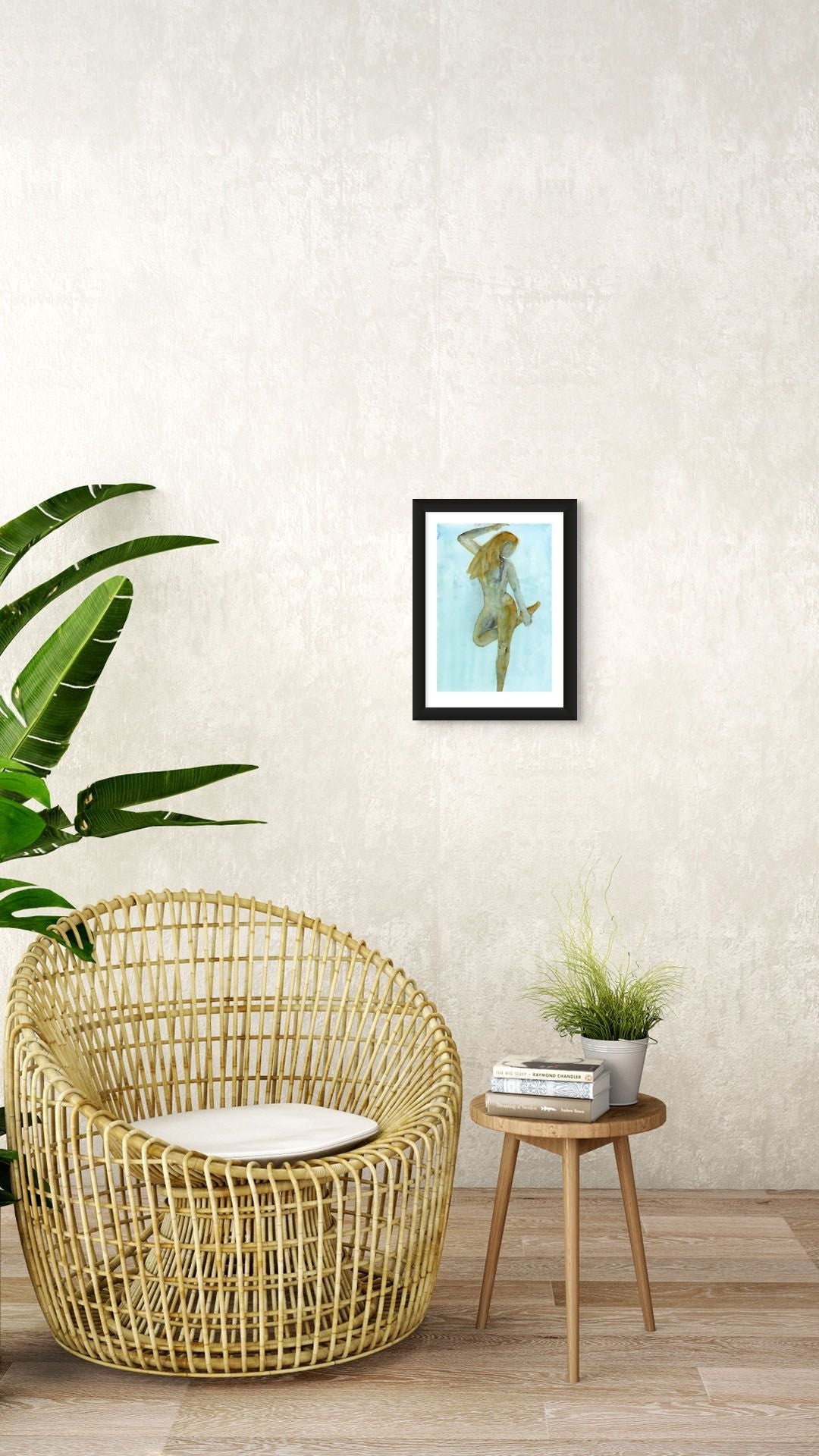 Limited Edition Fine Art Giclée Print of a watercolour female figure embodying the season of Winter, A3 sized, displayed on a wall. The colours are an earthy gold and brown with graphite on a beautiful blue background. 