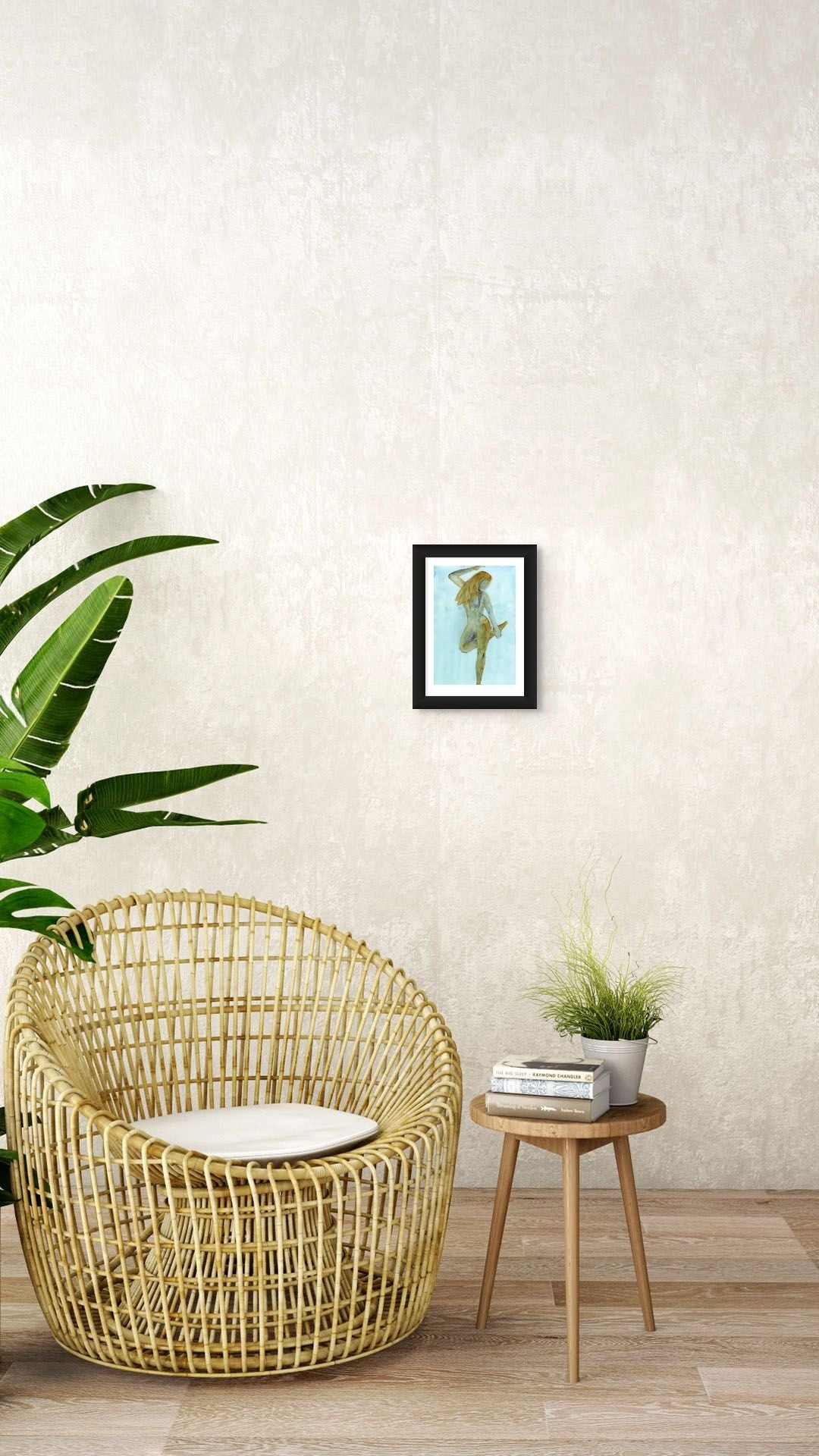 Limited Edition Fine Art Giclée Print of a watercolour female figure embodying the season of Winter, A4 sized, displayed on a wall. The colours are an earthy gold and brown with graphite on a beautiful blue background. 